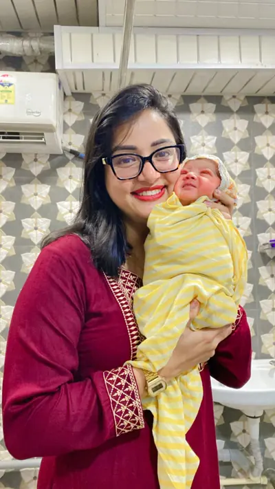 A new mother with her baby alongside Dr. Deepika Rawat